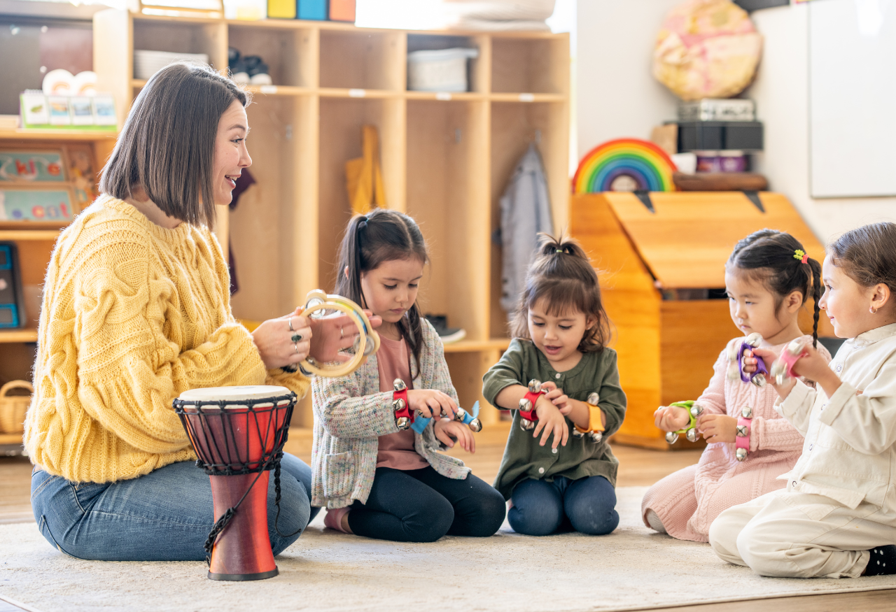 kids in classroom playing with musical instruments